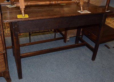 Lot 1182 - An 18th century mahogany side table, the chamfered legs joined by a H form stretcher, 72cm by 121cm