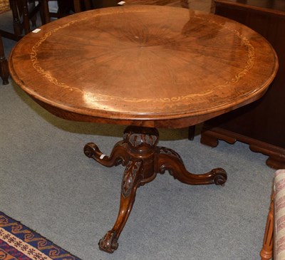 Lot 1188 - A Victorian figured walnut marquetry, inlaid circular tilt top breakfast table, on a carved and...