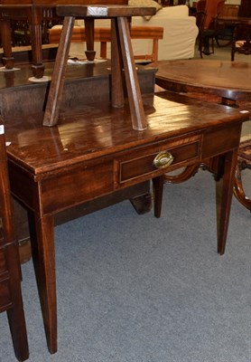 Lot 1189 - A George III style fold over tea table, with central frieze drawer, on square tapering legs...