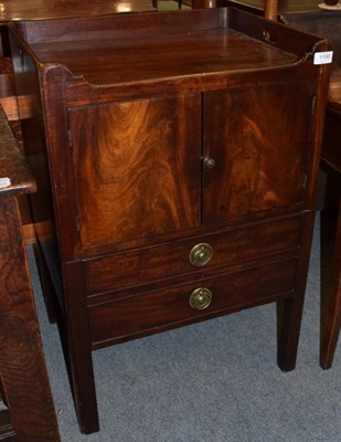 Lot 1190 - A George III mahogany tray top bedside commode, late 18th century, with two cupboard doors...