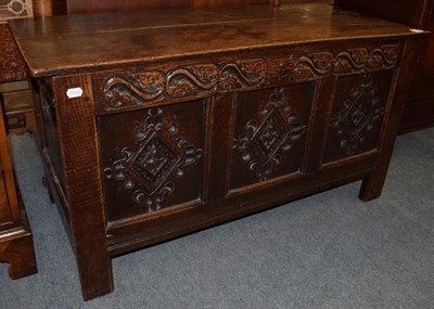 Lot 1191 - A late 19th/early 20th century carved oak three panel coffer, 66cm by 121cm by 51cm