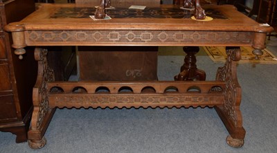 Lot 1193 - A late Victorian Gothic revival writing or central table, 120cm wide