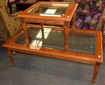 Lot 1201 - A reproduction glass top yew wood coffee table; with a matching square example (2)