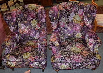 Lot 1207 - A pair of Victorian style wing back armchairs upholstered in Designers Guild fabric 91cm wide