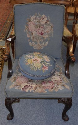 Lot 1215 - A carved armchair with eagle hand grips and eagle cabriole legs