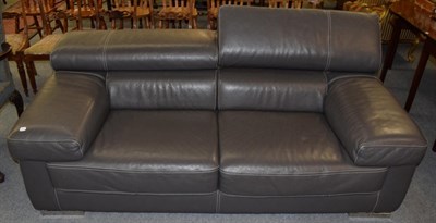 Lot 1216 - A grey leather two seater sofa with adjustable headrests