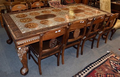 Lot 1230 - An 8ft carved Bombay rosewood dining table of Indian design, intricately inlaid with floral...