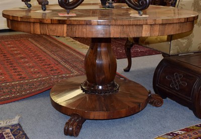 Lot 1234 - William IV rosewood pedestal breakfast table, on massive baluster standard and scroll carved...