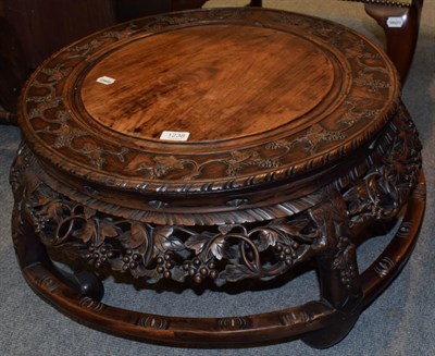 Lot 1238 - A Chinese circular carved hardwood table, approximately 65cm diameter