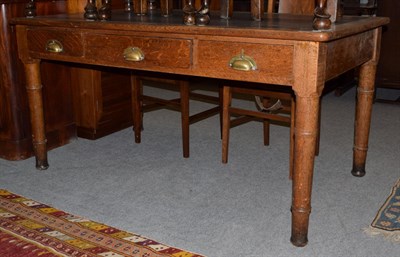 Lot 1244 - A late 19th/ early 20th century large oak leather inset writing table, 77cm by 153cm by 90cm