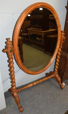 Lot 1263 - A Victorian walnut cheval mirror, 3rd quarter 19th century, the pivoting oval mirror within a...