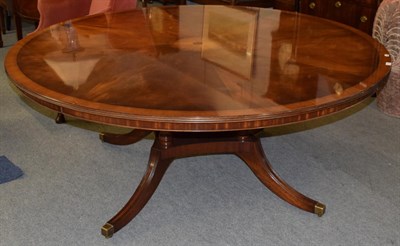 Lot 1268 - A Bevan Funnell 6ft reproduction mahogany circular top dining table, the top raised on four...