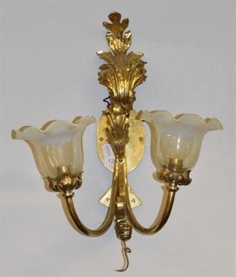 Lot 1283 - A brass acanthus leaf cast twin light wall sconce, with vaseline shades, stamped Ediswan