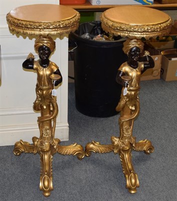 Lot 1285 - A pair of reproduction gild decorated torcheres in the form of blackamoors