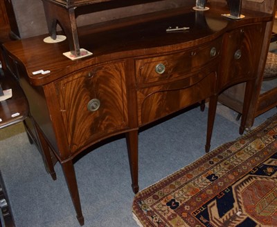 Lot 1289 - A Georgian style mahogany serpentine fronted sideboard, 92cm by 146cm by 56cm