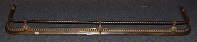 Lot 1290 - A Victorian steel and gilt brass ropetwist fender, circa 1860, 150cm by 32cm