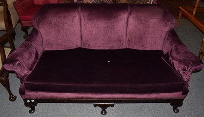 Lot 1291 - A 1920s sofa upholstered in purple velvet, with mahogany frame