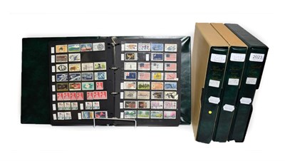 Lot 2023 - USA 4 Boxed Albums with slip cases. A dealer's stock both mint and used, many 1000s  Mint in...