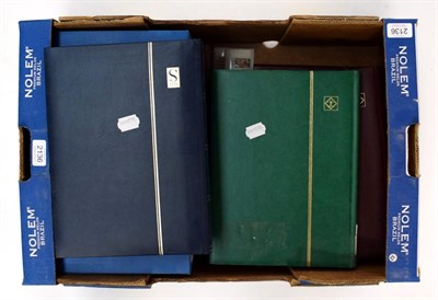 Lot 2136 - Box of stamps with 7 stock books filled with worldwide stamps mint and used 1000s. Box file...