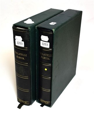 Lot 2253 - Two used and empty Stanley Gibbons leather bound stamp albums in slip cases.