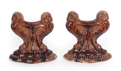 Lot 1003 - A Pair of Doulton Lambeth Stoneware Fire Rests, each modelled with two stylised owls, brown glazed