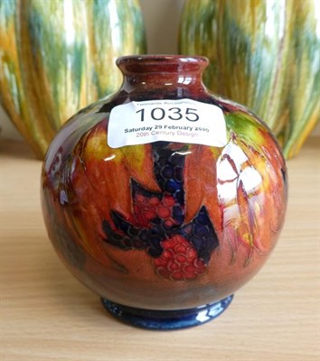 Lot 1035 - William Moorcroft (1872-1945): A Flambé Leaf and Blackberry Pattern Vase, impressed MADE IN...