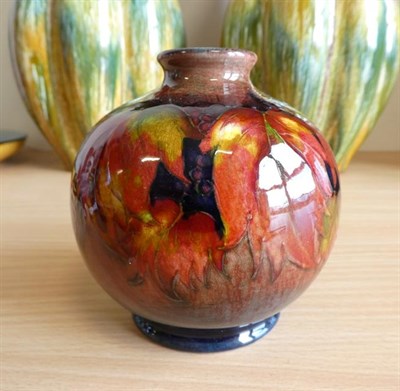Lot 1035 - William Moorcroft (1872-1945): A Flambé Leaf and Blackberry Pattern Vase, impressed MADE IN...