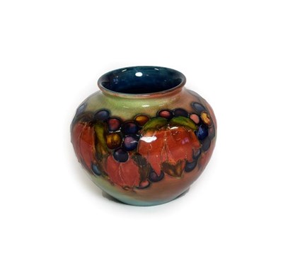 Lot 1036 - William Moorcroft (1872-1945): A Flambé Leaf and Grape Pattern Vase, impressed MADE IN...