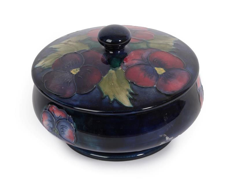 Lot 1041 - William Moorcroft (1872-1945): A Pansy Pattern Bowl and Cover, on a blue ground, impressed...