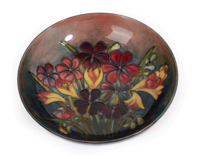 Lot 1044 - Walter Moorcroft (1917-2002): A Flambé Spring Flowers Pattern Bowl, impressed factory marks...