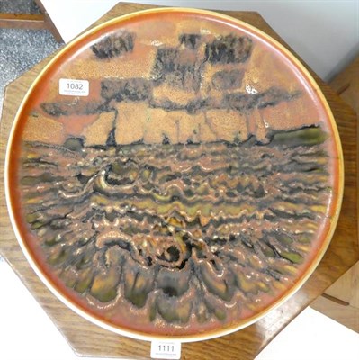 Lot 1082 - Tony Morris for Poole Pottery: A Studio Charger, circa 1962-4, painted with a seascape in...