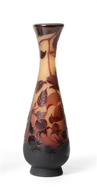 Lot 1088 - An Art Nouveau D'Argental Cameo Glass Vase, of slender form, cased in magenta over a graduated...
