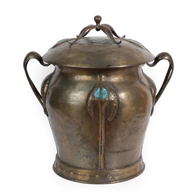 Lot 1092 - A Liberty & Co Arts and Crafts Patinated Brass Coal Bucket and Cover, the embossed decoration...