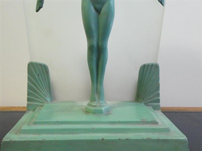 Lot 1099 - An Art Deco Figural Green Painted Table Lamp, modelled as a nude female on tip toes with arms...