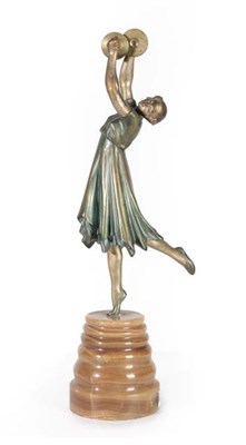 Lot 1100 - An Art Deco Patinated Bronze Figure, of a girl on one leg, playing cymbals, on a turned...