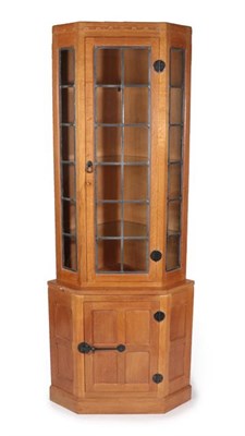 Lot 1113 - Workshop of Robert Mouseman Thompson (Kilburn): An English Oak Corner Display Cupboard, post...