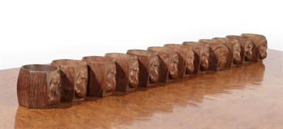 Lot 1132 - Workshop of Robert Mouseman Thompson (Kilburn): A Set of Twelve English Oak Napkin Rings, post...