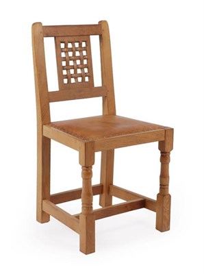 Lot 1152 - Cat and Mouseman: A Lyndon Hammell (Harmby) English Oak Lattice Back Chair, nailed leather seat, on