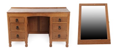 Lot 1171 - Squirrelman: A Wilfrid Hutchinson (Husthwaite) Panelled Oak Dressing Table, the mirror with...