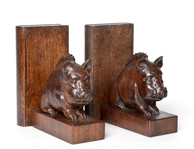 Lot 1176 - Woodpeckerman: A Stan Dodds (1928-2012) Carved Stained English Oak Wild Boar Bookends, both seated