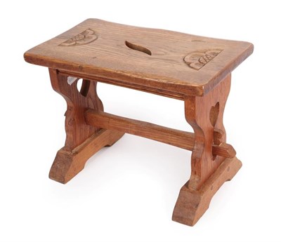 Lot 1178 - Yorkshire School: An English Oak Stool, the top with carved rose and leaf aperture, on two...