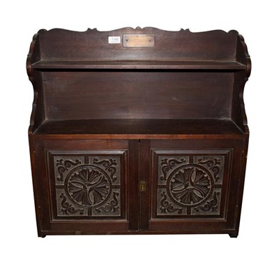 Lot 1180 - An Arts & Crafts Mahogany Wall Cupboard, possibly Keswick School, with two shelves above two...