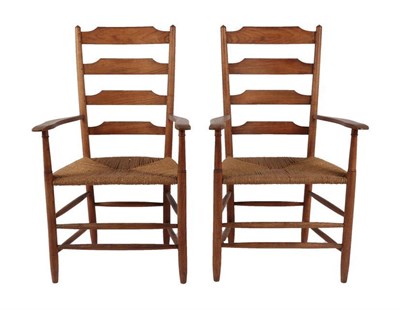 Lot 1184 - A Pair of Cotswold School Ash Ladderback Armchairs, with rush seats, 105cm (2)  Philip Clissett...