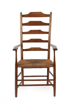 Lot 1185 - A Cotswold School Ash Ladderback Armchair, with rush seat, 112cm