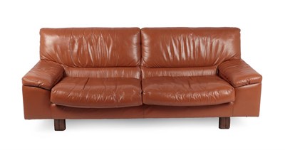 Lot 1202 - A Pair of 1970's Tetrad Brown Leather Sofas, on mahogany feet, labelled tetrad ENGLAND MAKERS...