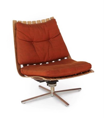 Lot 1211 - A Georg Eknes Swivel Lounge Chair, 1960's, with a frame of moulded rosewood slats, on a...