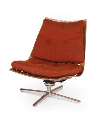 Lot 1212 - A Georg Eknes Swivel Lounge Chair, 1960's, with a frame of moulded rosewood slats, on a...