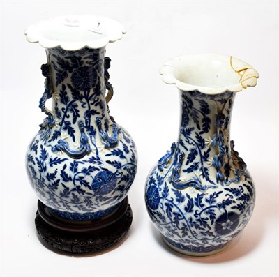 Lot 7 - A pair of 19th century Chinese blue and white vases (one a.f.); together with a hardwood stand (3)