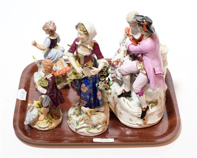 Lot 24 - A 19th century porcelain figural group of a courting couple; together with four other porcelain...
