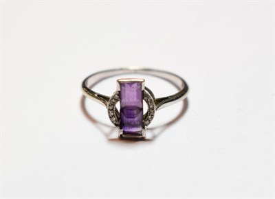 Lot 49 - An Art Deco amethyst and diamond ring, finger size O1/2  NB: one diamond deficient